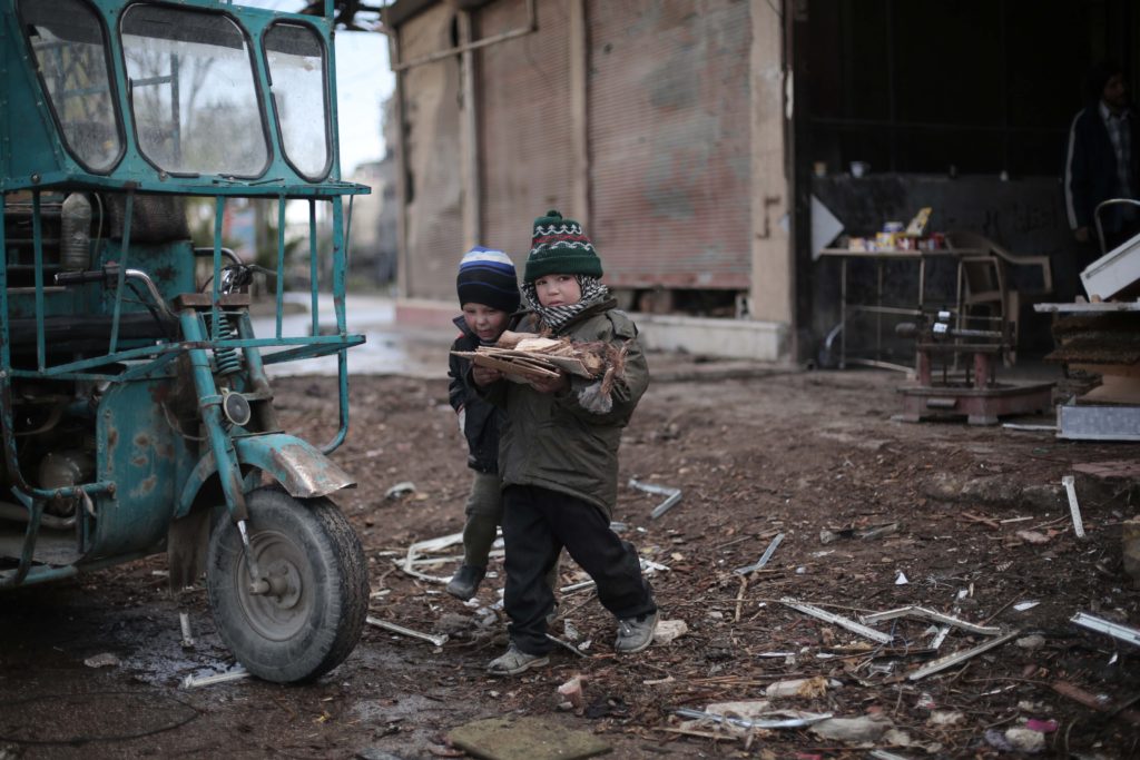 On 1 January, two boys carry chopped firewood in Kafar Batna village in Rural Damascus Suburbs.  Following almost five years of the Syria crisis, 4.5 Million people continue to live in areas- like this one- that are hard to reach for the humanitarian community. Almost 400,000 of those are besieged.  A very harsh weather conditions are amongst many difficulties that civilians have to endure to survive. UNICEF is targeting one million children throughout the country with winter supplies during the 2015/2016 winter season.   So far, winter clothing kits and blankets have reached 95,000 children while delivery and distribution is ongoing for 545,000 children.  In addition, 2,000 heaters are currently being installed in classrooms benefiting 80,000 children.